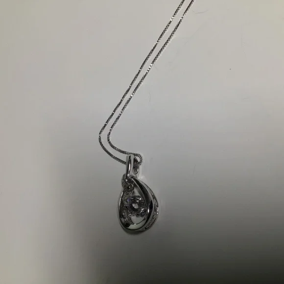 Kay Jewelers Infinity Teardrop Pendant with Free-floating Stone. - Picture 9 of 10